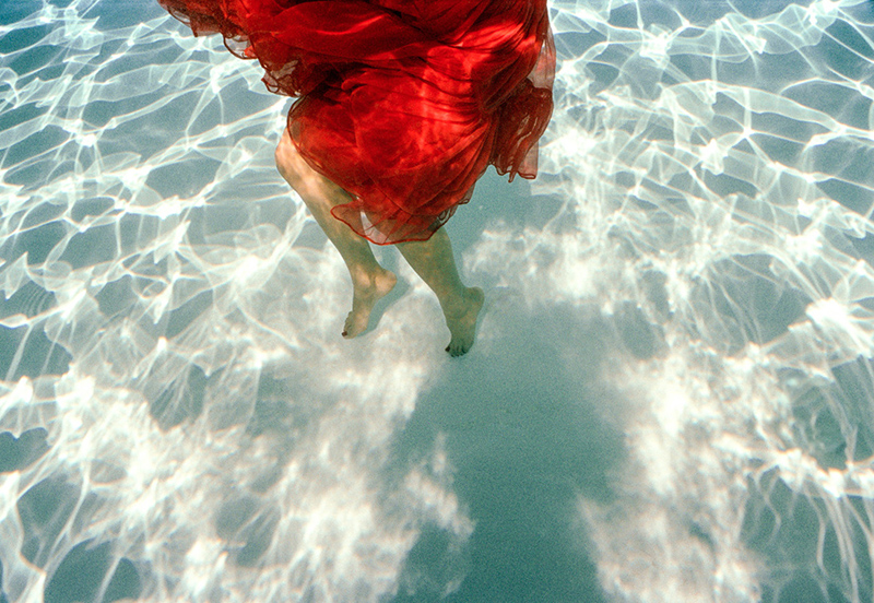 red-dress-woman-in-swimming-pool-photography-phillip-graybill
